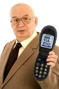 Mature businessman using his cell-phone